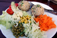 Speck dumplings with salad